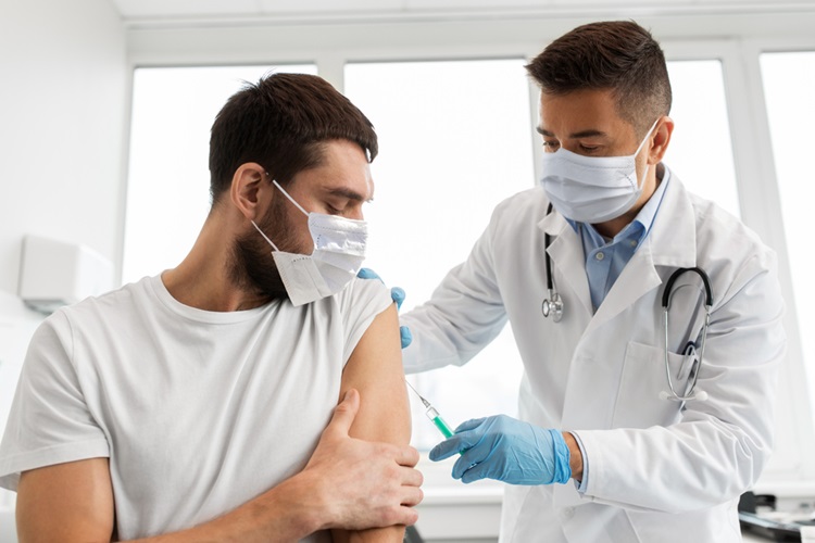 Illustration of a person receiving a vaccination shot