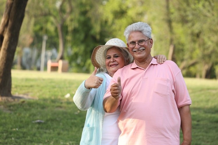 Elderly couple discussing insurance options